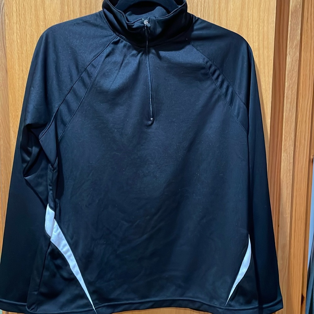 Jockey Women’s quarter-zip pullover.  100% polyester. Black with white detail.